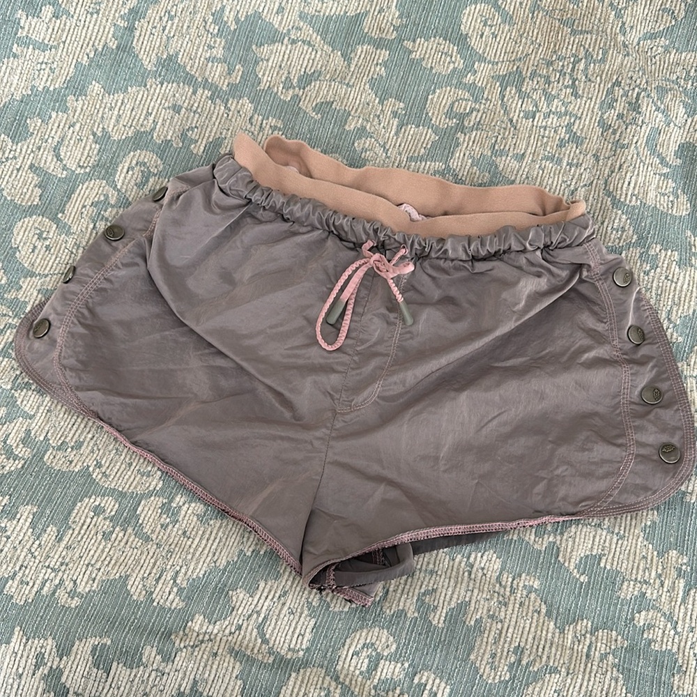 Free people movement pinkish gray shorts.